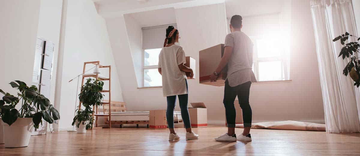 Young couple moving into a new home